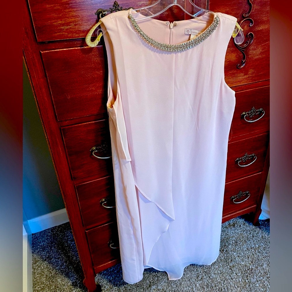 A beautiful blush pink dress.